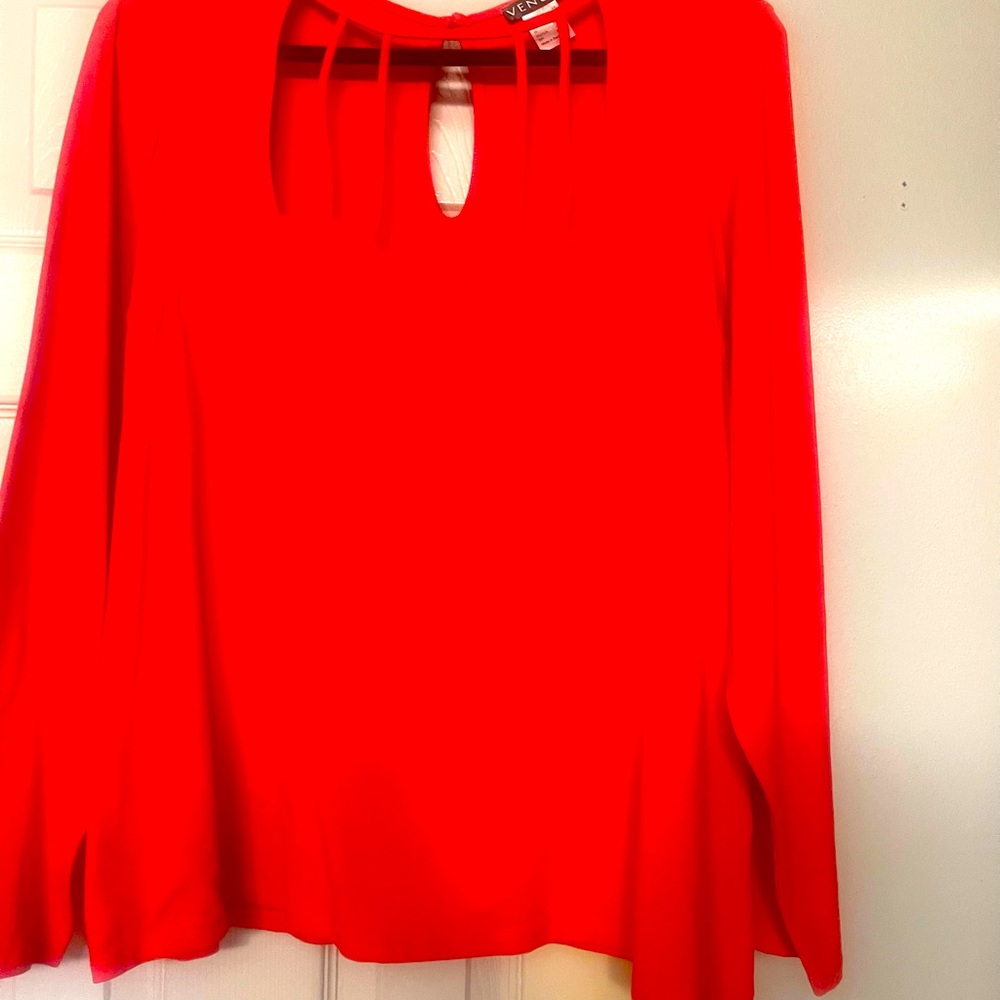 Woman top red in color cute cut outs in front